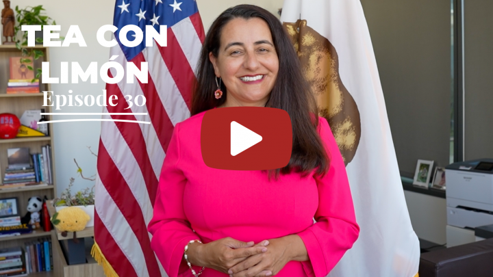 Senator Limón standing in front of the US flag and California flag