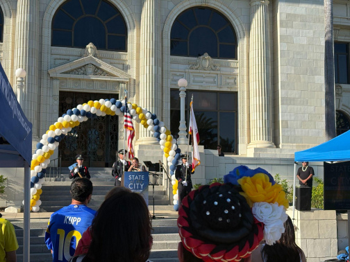 Dancers and a color guard are present at the Annual State of the City Event.