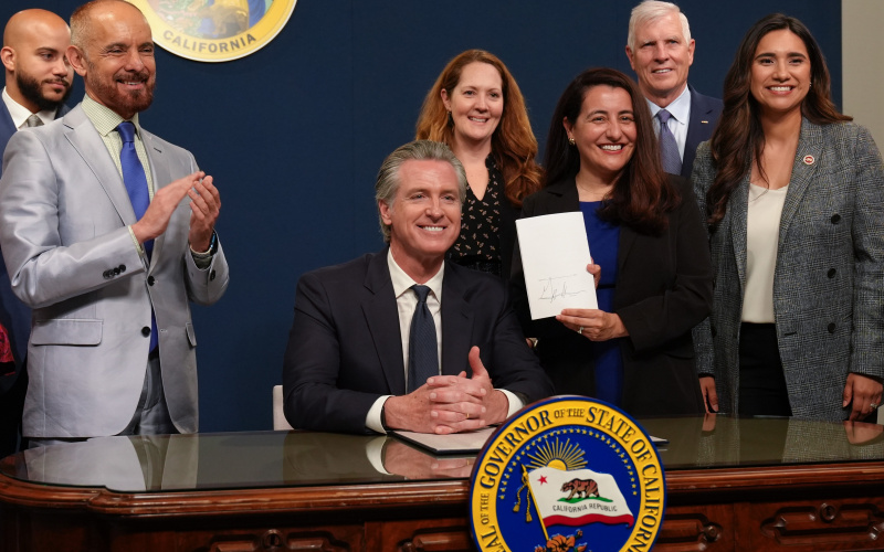 Governor Newsom signs Rainy Day Fund with Senator Limon and other members of the Senate