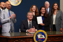 Governor Newsom signs Rainy Day Fund with Senator Limon and other members of the Senate